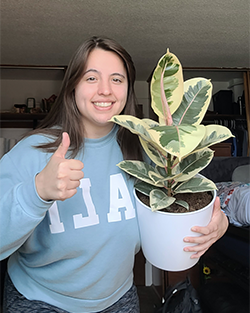 cali showing off her new rubber tree that she got